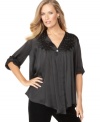 This versatile blouse from J Jones New York is all about the details. Gold beading and pleats at the chest marry satin fabric for effortless sophistication.