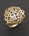 From the Mauresque collection, a lace-inspired cocktail ring in 18 Kt. yellow gold with diamond pavé. With signature ruby accent. Designed by Roberto Coin.