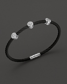 From the Celtic Noir Collection, a stackable bangle in white gold and black PVD cable with diamond stations. Designed by Charriol. From the Celtic Noir Collection, a stackable bangle in white gold and black PVD cable with diamond stations. Designed by Charriol.