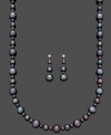 Exotic shimmer. This unique jewelry set features a matching strand necklace and pair of drop earrings. Crafted from black cultured freshwater pearls (4-10 mm) and a sterling silver setting. Approximate length: 18 inches. Approximate drop: 1-1/2 inches.