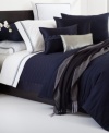 This Windsor Navy quilt from Hugo Boss turns your bed into an oasis of tranquility. 350-thread count cotton sateen and silk textures provide endless comfort. Zipper closure.