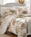 Perfect palm trees create a relaxing oasis in this Bonnie Cove quilt from Tommy Bahama Home. Accompanied by blooming exotic florals and a soothing, airy palette for a fresh appeal. Reverses to a tonal palm tree print.