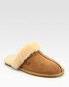 Shearling lining and trim create the ultimate in casual luxury. Round-toe design Leather sole Imported Fur origin: Australia