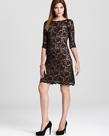 Brimming with dark romance, this Karen Kane dress flaunts allover black lace for a captivating cocktail ensemble. Brimming with dark romance, this Karen Kane dress flaunts allover black lace for a captivating cocktail ensemble.