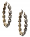 Fashion from the past, reinvented by Lucky Brand. These hippie-chic earrings feature a gold tone oblong shape with silver tone inlay accents. Crafted in gold tone and silver tone mixed metal. Approximate drop: 1-5/8 inches.