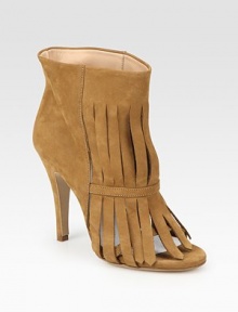 Trendy fringe and a peep toe complement this ankle-grazing suede style. Self-covered heel, 4 (100mm)Suede upperPull-on styleLeather lining and solePadded insoleMade in ItalyOUR FIT MODEL RECOMMENDS ordering one half size up as this style runs small. Trendy fringe and a peep toe complement this ankle-grazing suede style. Self-covered heel, 4 (100mm)Suede upperPull-on styleLeather lining and solePadded insoleMade in ItalyOUR FIT MODEL RECOMMENDS ordering one half size up as this style runs small.