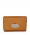 Stylish wallet in supple, caramel brown leather - Practical and polished compact rectangular style - Buffalo leather has a slight sheen - Pale gold, oval Mulberry plaque - Popper closure - Eight credit or business card slots - Expandable pocket for bills - Two slip pockets - Zip coin compartment - Understated yet undeniably chic, also makes a superb gift