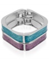 Double your pleasure. This pair of bangles from Betsey Johnson is crafted from rhodium-plated mixed metal with purple and teal glitter accents, as well as silver-tone details for a style infusion. Approximate diameter: 4 inches.