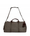 Both rugged and contemporary, Ralph Laurens leather trimmed duffle bag is a classic choice for stashing away your essentials - Dark brown leather trim, double top handles, removable buckled shoulder strap, luggage tag, top zip, inside pocket, durable olive canvas - Pack to the brim for travel, or tote around workout gear for trips to the gym