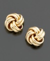 Ribbed texture and knotted detail are richly understated–and perfect for the office. Set in 18k gold. 1/2 diameter.