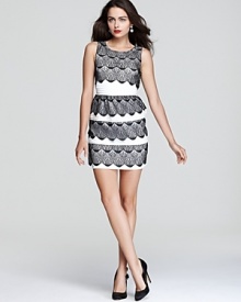 Classic in black and white, BCBGMAXAZRIA goes back to basics with this timeless dress, rendered in tiers of scalloped lace mixed with pintucked panels. Classic in black and white, BCBGMAXAZRIA goes back to basics with this timeless dress, rendered in tiers of scalloped lace mixed with pintucked panels.