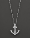 This diamond anchor pendant is crafted from 14k white gold and hangs from a 17 cable chain.