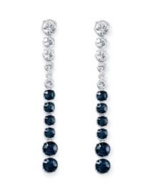 Revel in utter elegance. Swarovski's Hot Montana drop earrings feature icy round-cut clear and Montana blue crystals in a silver tone mixed metal setting. Approximate drop: 3 inches. Revel in utter elegance. Swarovski's Hot Montana drop earrings feature icy round-cut clear and Montana blue crystals in a silver tone mixed metal setting. Approximate drop: 3 inches.