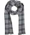 Forever-favorite plaid gets a kick of contemporary cool in Closeds cool blue accented scarf - Fringed edges, solid charcoal heather reverse - Team with modern coats and sleek leather gloves, or wear indoors over soft pullovers and everyday favorite slim legged trousers