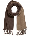 Wrap up in luxe style with this reversible two-tone scarf from Polo Ralph Lauren - Two-tone wool-blend scarf with fringed trim - Pair with a cashmere pullover, straight leg jeans, a parka, and suede ankle boots