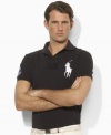 Cut for a trim, modern fit from breathable cotton mesh, this iconic short-sleeved polo shirt is designed exclusively for Ralph Lauren's collection celebrating the Wimbledon Championships.