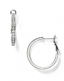 A sophisticated sparkle is yours with these inside-out pierced earrings. Fine cubic zirconia studs are mixed with sterling silver with a platinum finish. A sophisticated sparkle is yours with these inside-out pierced earrings. Fine cubic zirconia studs are mixed with sterling silver with a platinum finish.