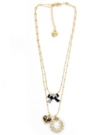 Time for love. This beautiful Betsey Johnson necklace features a leopard heart, decorative clock and bow in mixed metal with crystal accents. Approximate length: 16 inches. Approximate drop: 1-1/2 inches. Time for love. This beautiful Betsey Johnson necklace features a leopard heart, decorative clock and bow in mixed metal with crystal accents. Approximate length: 16 inches. Approximate drop: 1-1/2 inches.