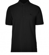 Casual yet sleek, Burberry Brits black cotton polo is cool way to dress up your laid-back looks - Classic collar, short sleeves, partial button-placket, tonal embroidered logo at chest, slit sides - Modern straight cut - Wear with your favorite jeans, a hoodie and sneakers