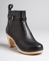 Sweedish Hasbeens adds a bit of equestrian detail to signature clog booties with buckled ankle details and pull tabs. Lighweight and stylish, they're a comfort-meets-cool choice.