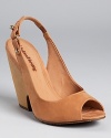 In matte nubuck leather, these undeniably chic Madison Harding wedges offer understated style.