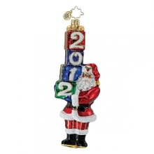 Santa carries a toppling tower of gifts, labeled with the year to celebrate the season. Santa carries a toppling tower of gifts, labeled with the year to celebrate the season.
