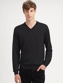 A casual-to-dressy must-have for the modern man, with a flattering v-neck and fitted ribbed sleeves.Ribbed v-neckLong sleeves with ribbed cuffsRibbed hemMerino woolHand wash or dry cleanImported