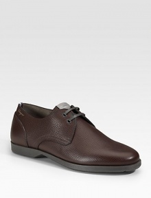 A two-eyelet derby style designed in pebbled calfskin leather. Leather lining Padded insole Rubber sole Made in Italy A two-eyelet derby style designed in pebbled calfskin leather. Leather lining Padded insole Rubber sole Made in Italy