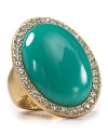 Aqua's oval stone cocktail ring steals the spotlight. The perfect complement to polished nail art.