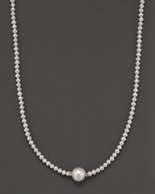 Fresh water pearl necklace with large center piece and 14 Kt. gold accent. Fresh water pearl necklace with large center piece and 14 Kt. gold accent.
