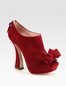 Suede peep toe ankle boot updated by a sculpted heel, back zipper and bow adornment. Self-covered heel, 5 (125mm)Covered platform, 1 (25mm)Compares to a 4 heel (100mm)Suede upperPeep toeBack zipperLeather lining and solePadded insoleMade in ItalyOUR FIT MODEL RECOMMENDS ordering one size up as this style runs small. 