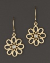Diamonds bloom in elegant 18K yellow gold settings. By Carelle.