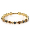Stacks of bracelets are a chic staple, and this rhinestone and topaz-encrusted style from Seasonal Whispers is a rich way to work the trend.