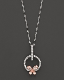 A dainty diamond butterfly pendant set in 14K. rose and white gold. A dainty diamond butterfly pendant set in 14K. rose and white gold.