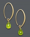 For a look that's divine. Luxurious hoops feature faceted peridot drops (6-3/4 ct. t.w.) suspended from a delicate 14k gold hoop setting. Approximate diameter: 1/3 inch.