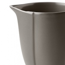Borrowing from nature, this porcelain creamer has a highly glossed surface and unusual contours, creating an interesting silhouette - a DVF signature - on the table. Borrowing from nature, this porcelain creamer has a highly glossed surface and unusual contours, creating an interesting silhouette - a DVF signature - on the table.
