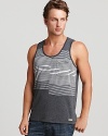 A unique, optically intriguing print of varying stripes is color-blocked on a soft cotton tank for a chilled-out, on-trend warm weather look.