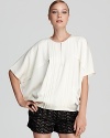 An ultra-billowy silhouette brings an ethereal quality to this airy DIANE von FURSTENBERG top, tailored in rich stretch silk.