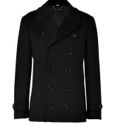 Classically sophisticated, this urbane take on the classic peacoat is elevated with a luxe cashmere-and-wool fabrication - Wide lapels, long sleeves with belted cuffs, double-breasted, front button placket, fitted silhouette - Pair with slim trousers or jeans and a cashmere pullover