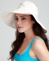 Glam it up in a lightweight cotton floppy hat from Helen Kaminski.