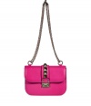 Glamorize every look with Valentinos bright pink leather shoulder bag, detailed with oversized rockstuds and a chain-link strap for that impossibly ladylike feel - Push-stud closure, removable chain shoulder strap, inside zippered back wall pocket - Carry as a pretty polish to cocktail dresses or tailored separates