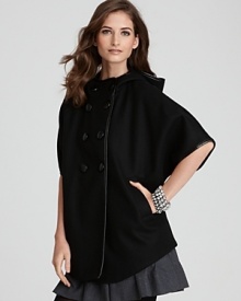 The covetable DKNY cape silhouette takes jacket form as your go-to layer for a fashion-forward winter. The covetable DKNY cape silhouette takes jacket form as your go-to layer for a fashion-forward winter.