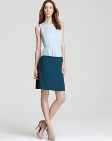 Contrasting a softly-feminine peplum top with a crisp pencil skirt, this DKNY dress fuses classic femininity with modern polish. Finish the look with a strand of pearls for demure fifties elegance. Contrasting a softly-feminine peplum top with a crisp pencil skirt, this DKNY dress fuses classic femininity with modern polish. Finish the look with a strand of pearls for demure fifties elegance.