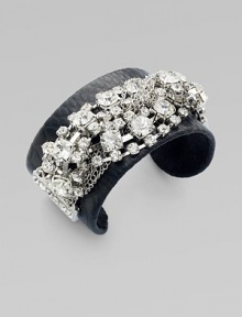 An edgy design with textured leather and dazzling rhinestone chains. LeatherBrassGlassDiameter, about 2½Slip-on styleImported An edgy design with textured leather and dazzling rhinestone chains. LeatherBrassGlassDiameter, about 2½Slip-on styleImported
