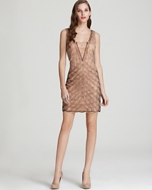 From the intricate beading to the scalloped hem, this Aidan Mattox dress offers a strikingly modern take on '20s-era glamour. From the intricate beading to the scalloped hem, this Aidan Mattox dress offers a strikingly modern take on '20s-era glamour.