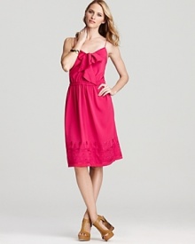 Effortlessly flirty, this DKNY dress flaunts a charming bow at the neckline and delicate embroidery at the hemline for head-to-toe charm. Effortlessly flirty, this DKNY dress flaunts a charming bow at the neckline and delicate embroidery at the hemline for head-to-toe charm.