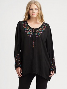 Beautifully woven and featuring exquisite embroidery, a tunic offering a relaxed fit that will work wonderfully with slim-fitting pants.Self-tie detail at embroidered necklineLong sleevesPull-on styleAbout 34 from shoulder to hemRayonMachine washImported Beautifully woven and featuring exquisite embroidery, a tunic offering a relaxed fit that will work wonderfully with slim-fitting pants.Self-tie detail at embroidered necklineLong sleevesPull-on styleAbout 34 from shoulder to hemRayonMachine washImported