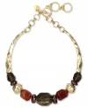 Drape you neckline in warm tones. Jones New York's collar necklace boasts multi-colored resin beads on a textured surface. Crafted in worn gold tone mixed metal. Approximate length: 17 inches + 3-inch extender.