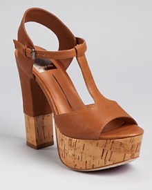 A glazed cork sole lends an unexpected touch to Dolce Vita's Baxter sandals, a T strap silhouette with girlish charm. A glazed cork sole lends an unexpected touch to Dolce Vita's Baxter sandals, a T strap silhouette with girlish charm.