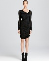 Helmut Lang's ruched dress boasts a form-fitting silhouette with flattering ruching.